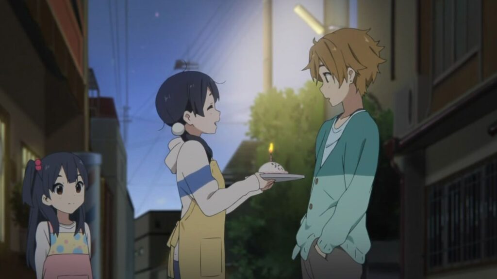 Tamako giving a cake to Mochizou in the Tamako Market anime